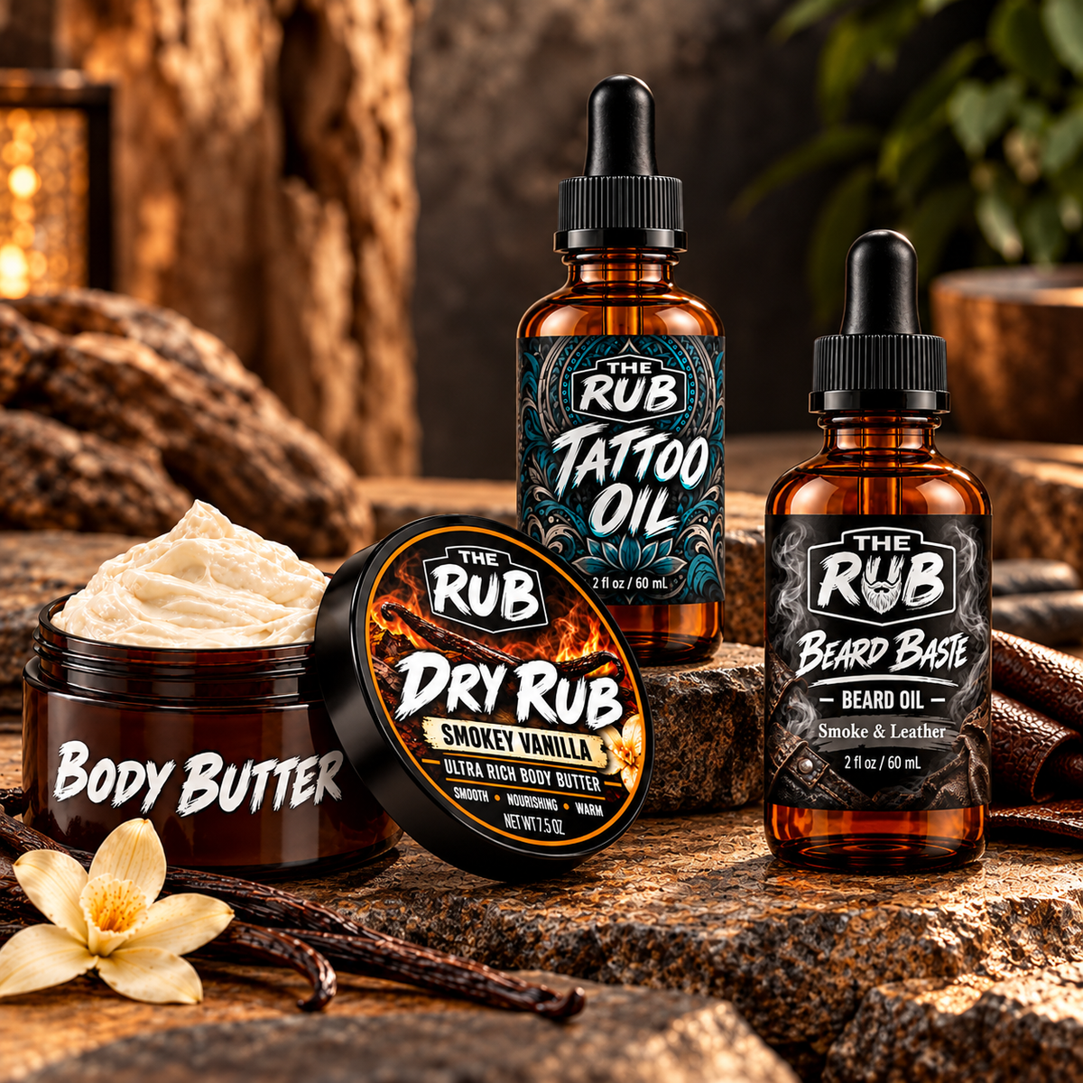 The Rub premium skin care collection featuring Dry Rub Smokey Vanilla Body Butter, Tattoo Oil, and Smoke & Leather Beard Baste Oil, displayed in a rustic setting with warm lighting, natural stone, and vanilla accents.