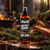 The Rub Secret Sauce Deep Cedar body spray in an amber 8 oz spray bottle with fresh woods and earthy cedar scent.