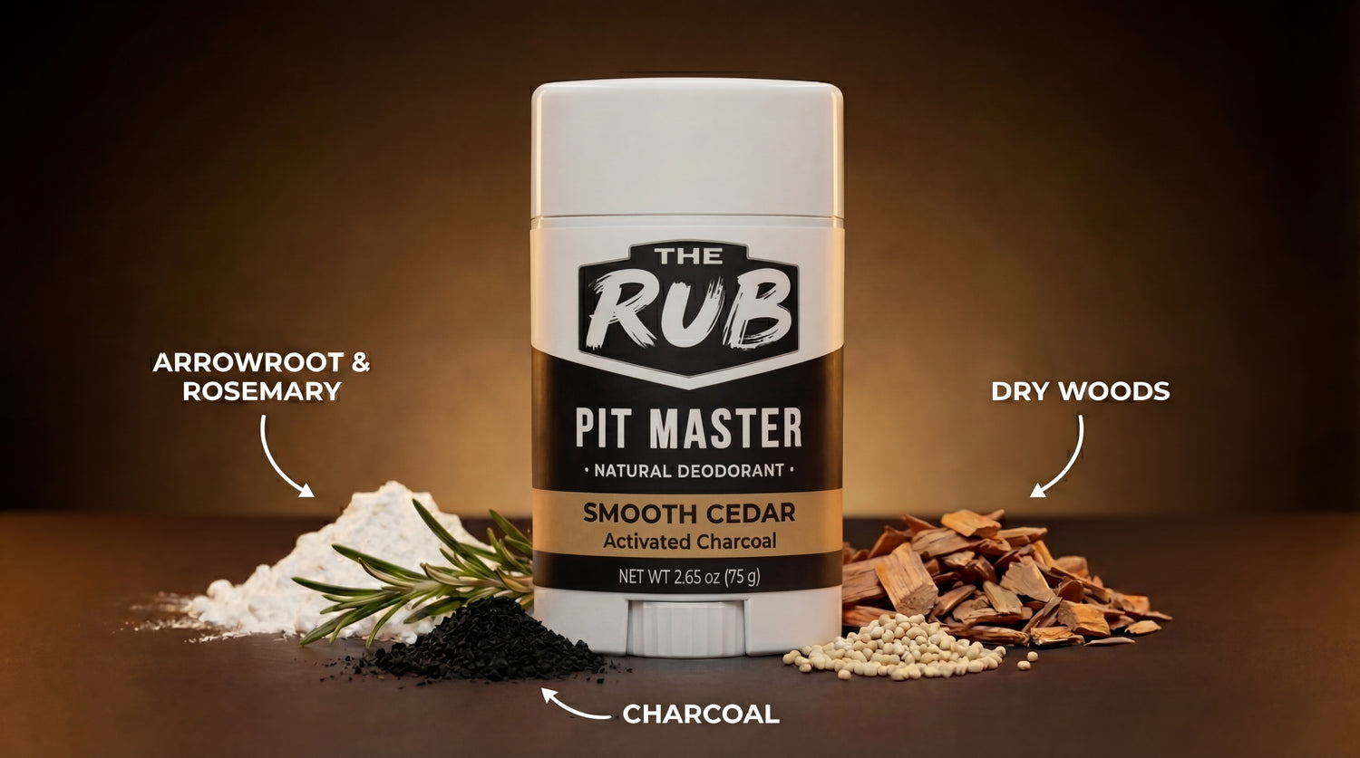 Smooth Cedar natural deodorant stick with surrounding ingredient piles of charcoal, dry woods, arrowroot, and rosemary.