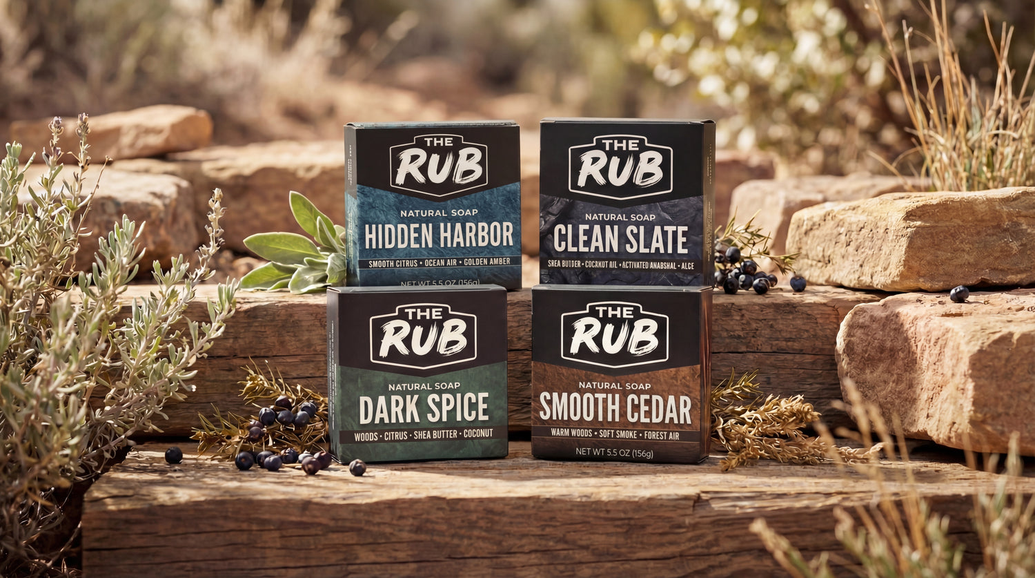 The Rub natural bar soap lineup featuring Hidden Harbor, Clean Slate, Dark Spice, and Smooth Cedar